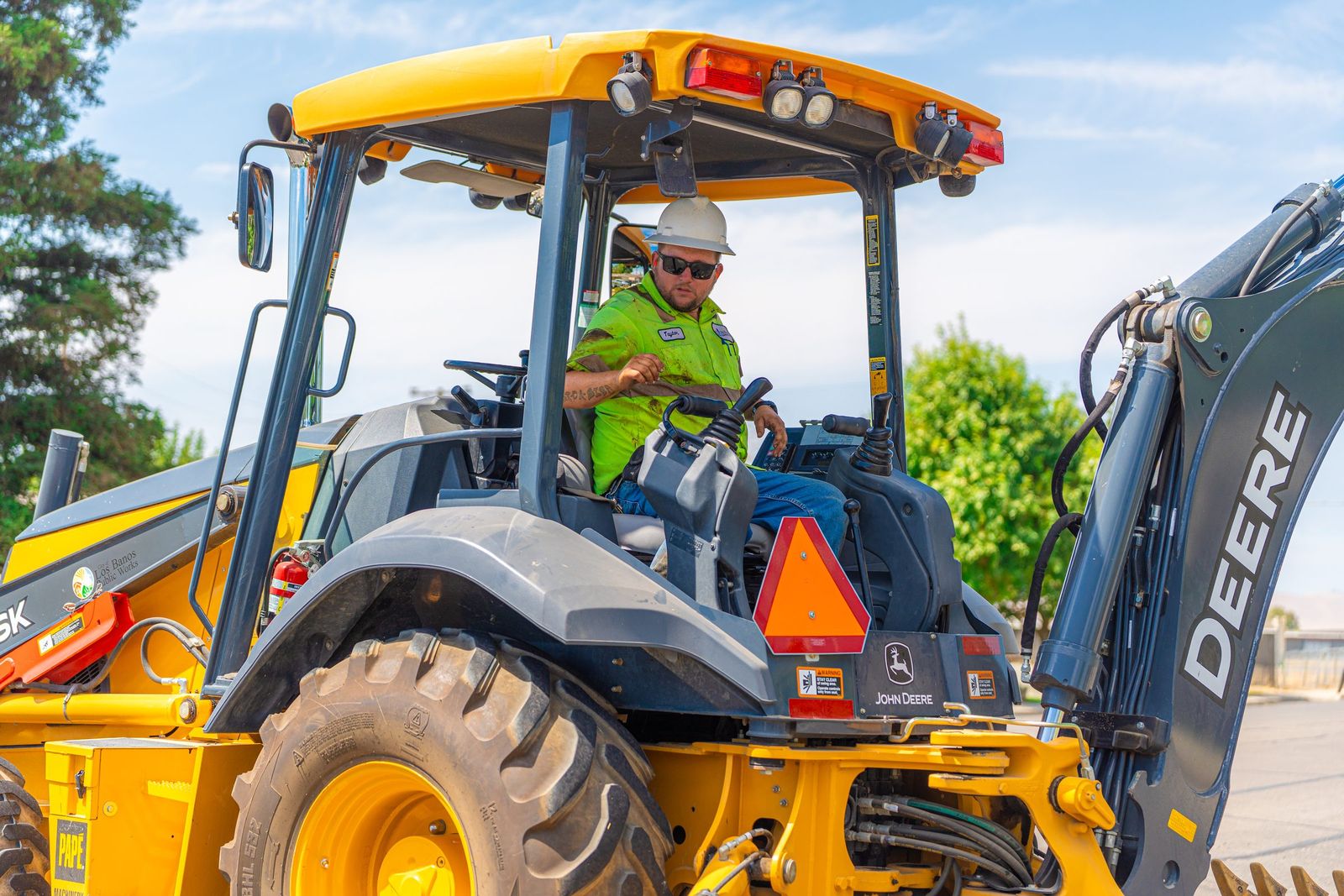 Backhoe operator at work — City of Los Banos