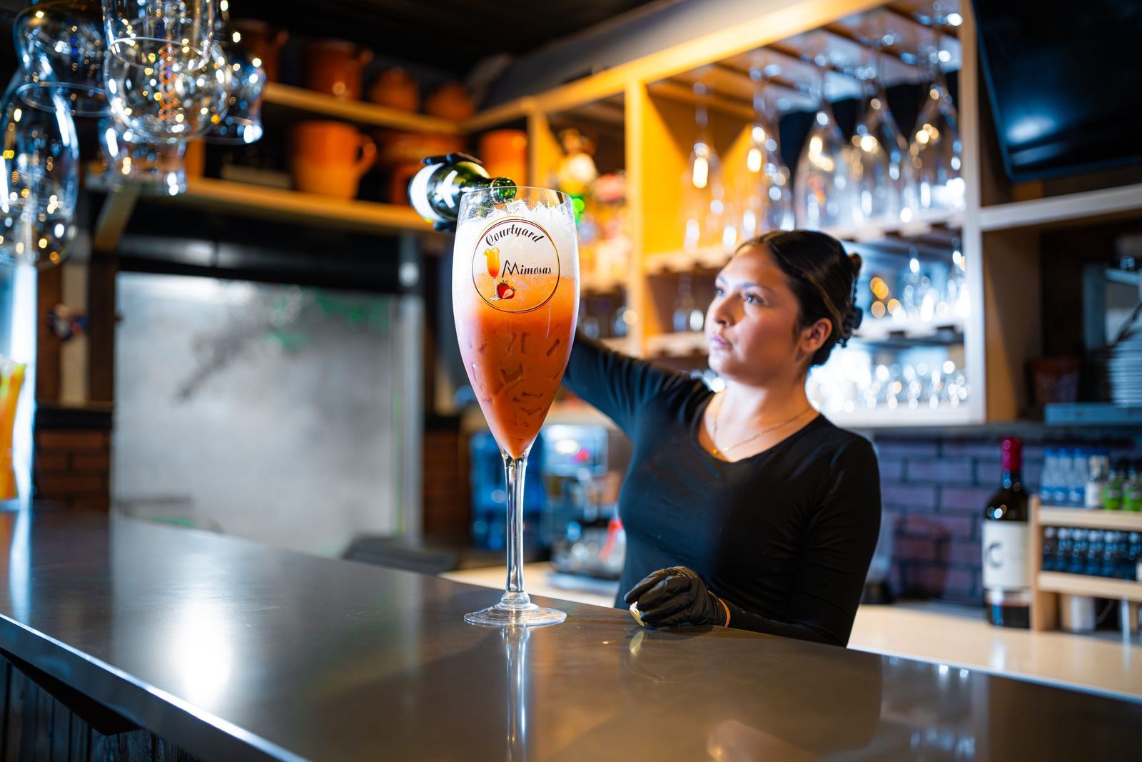 Pouring a giant mimosa — City of Los Banos