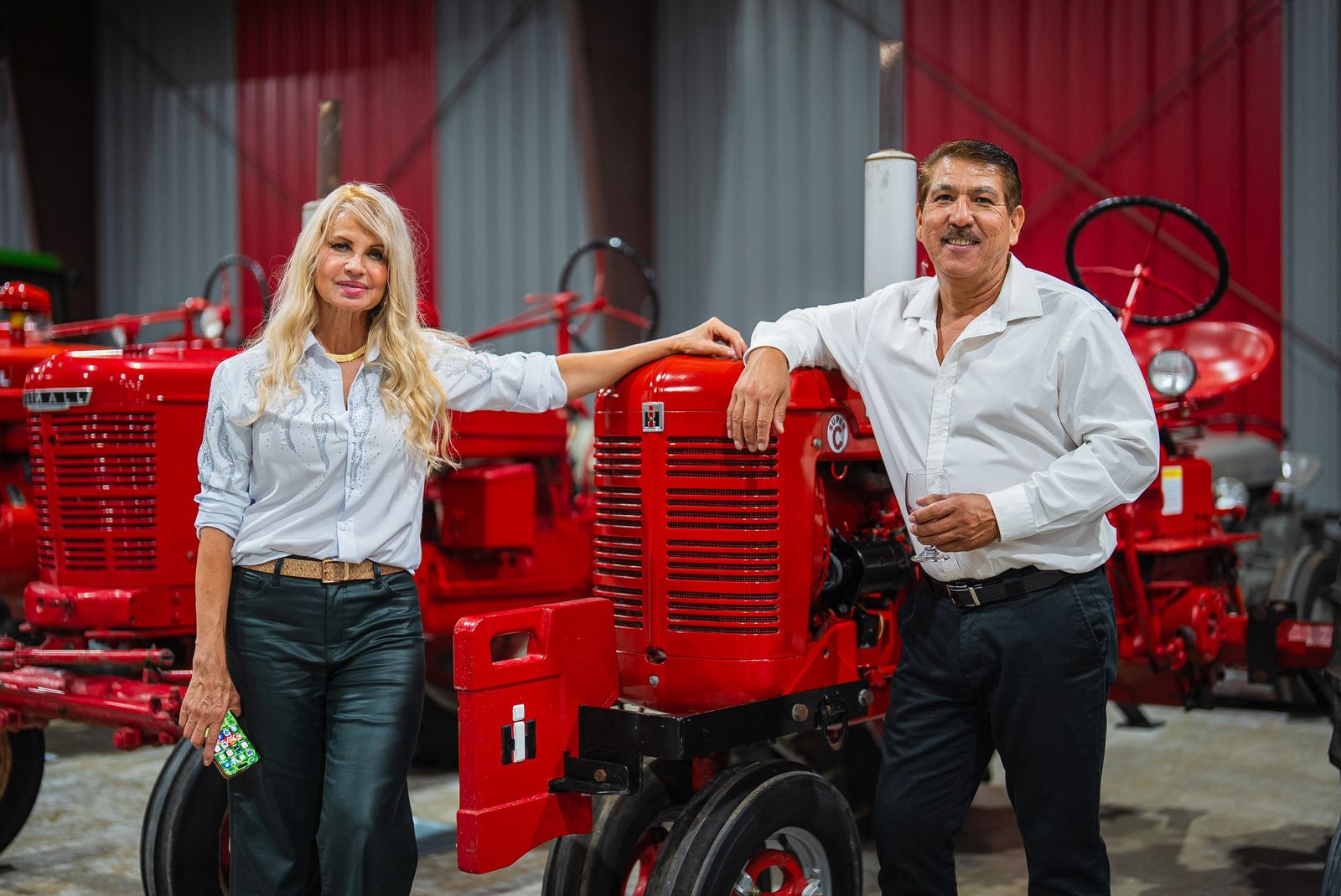 Couple with a red tractor — City of Los Banos