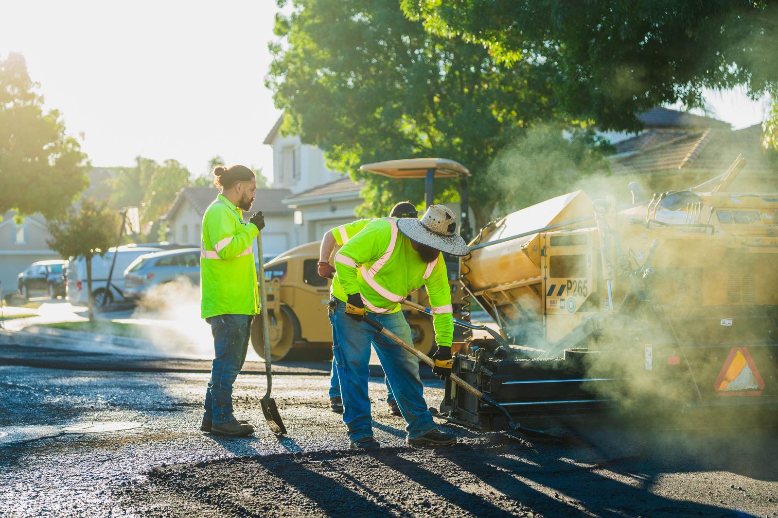 Paving crew in golden backlight — City of Los Banos