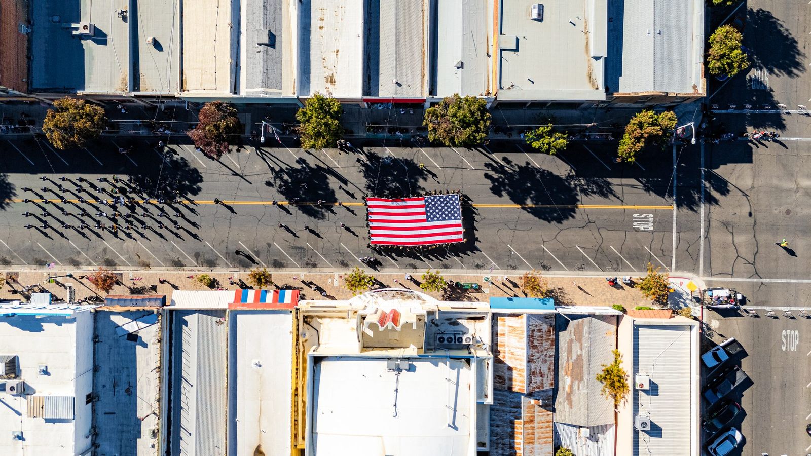 Flag on parade from above — City of Los Banos