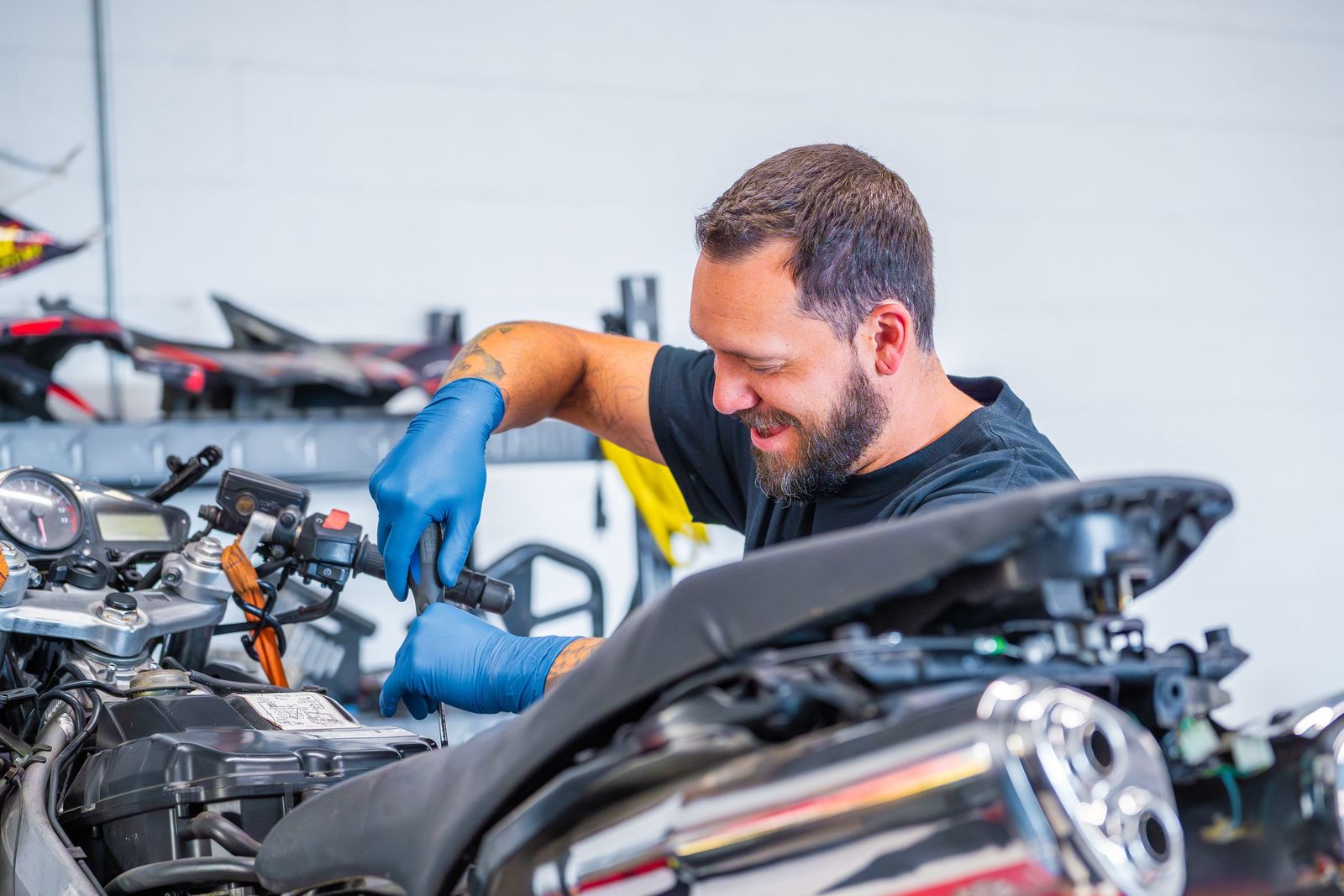 Motorcycle mechanic at work — City of Los Banos