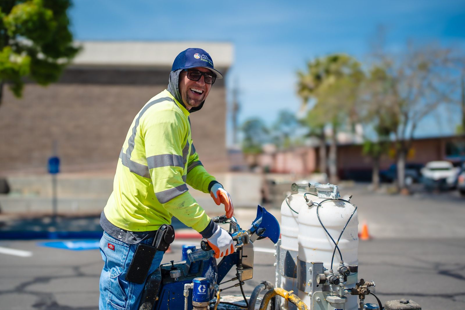 A Public Works striping operator laughing at the machine