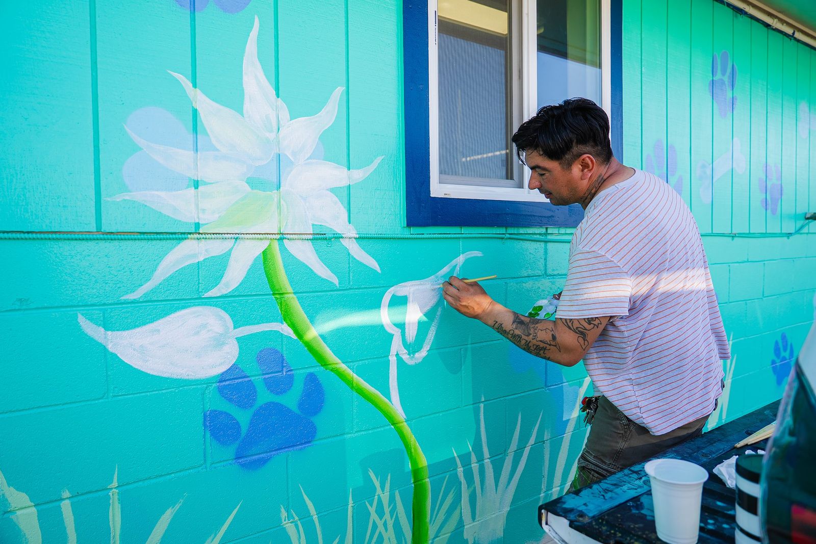 Volunteer painting the animal shelter mural — City of Los Banos