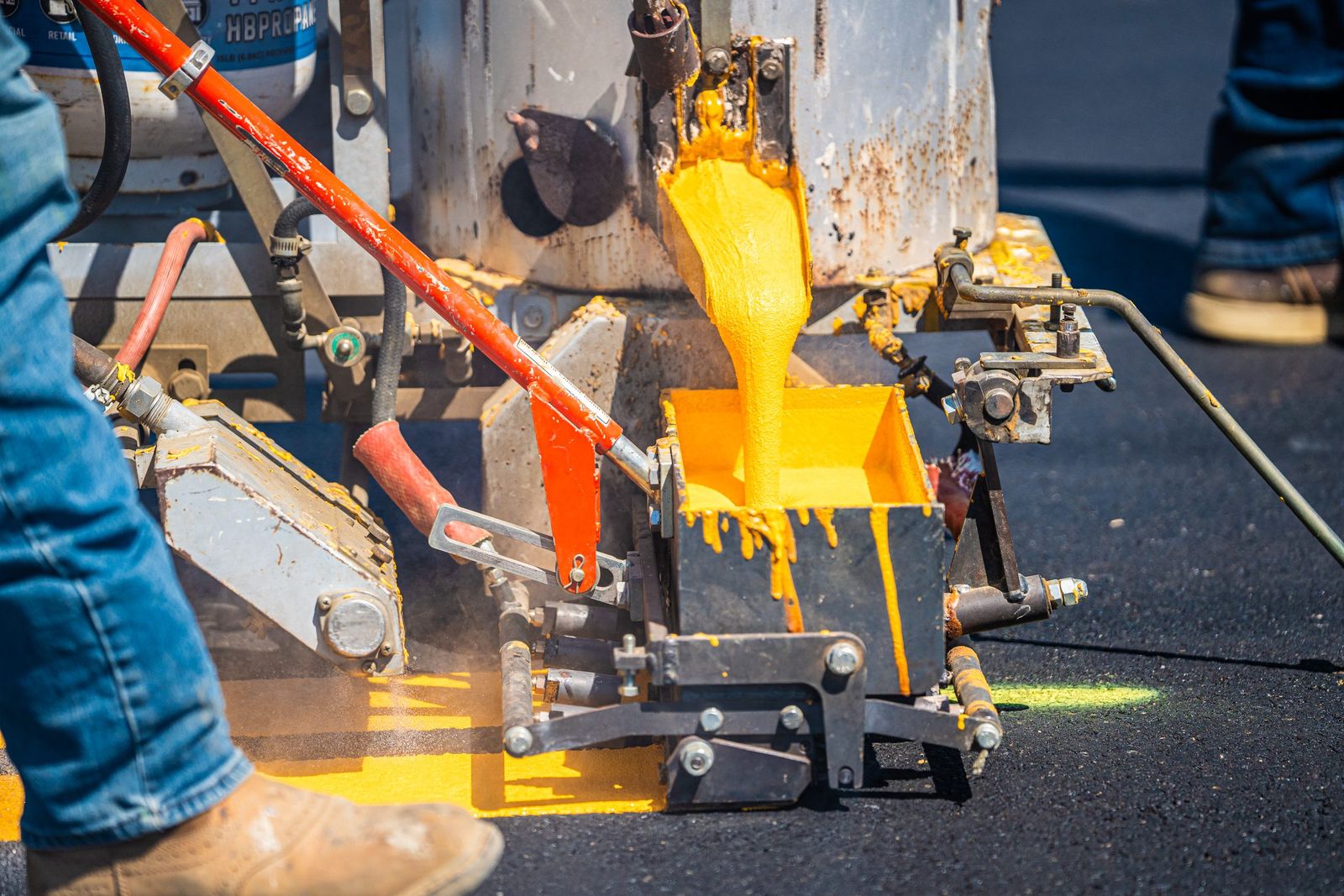 Pouring yellow road paint — City of Los Banos