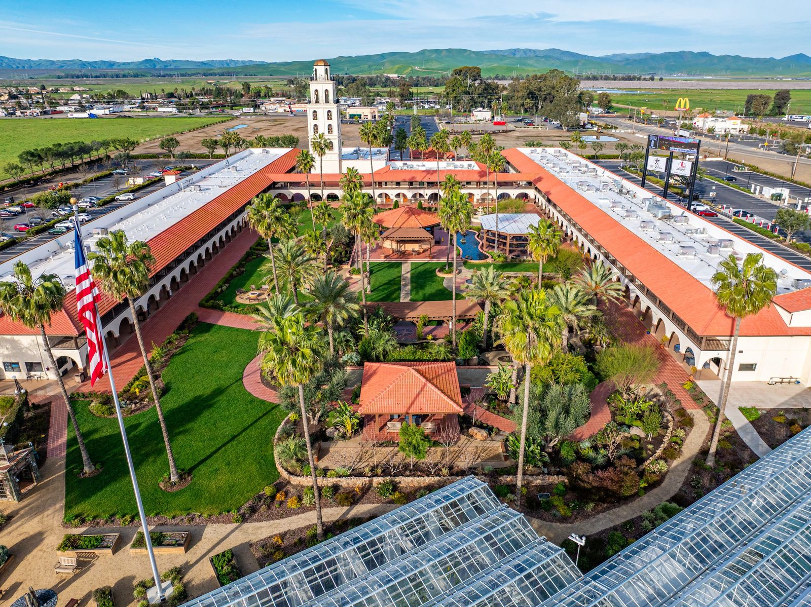 Courtyard and bell tower from the air — Hotel Mission de Oro