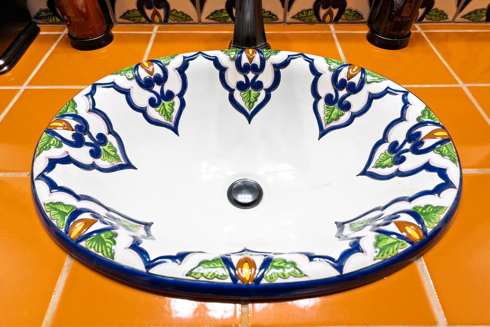 Hand-painted basin on orange tile — Hotel Mission de Oro