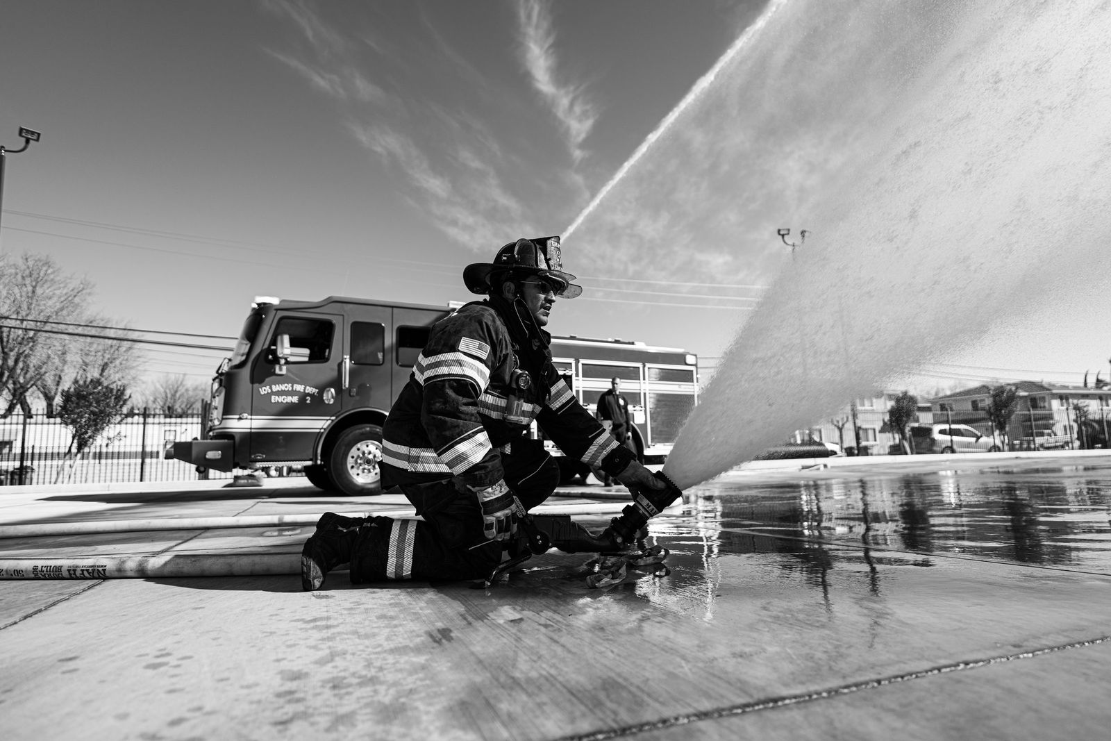 Hose stream in black and white — Los Banos Fire Department