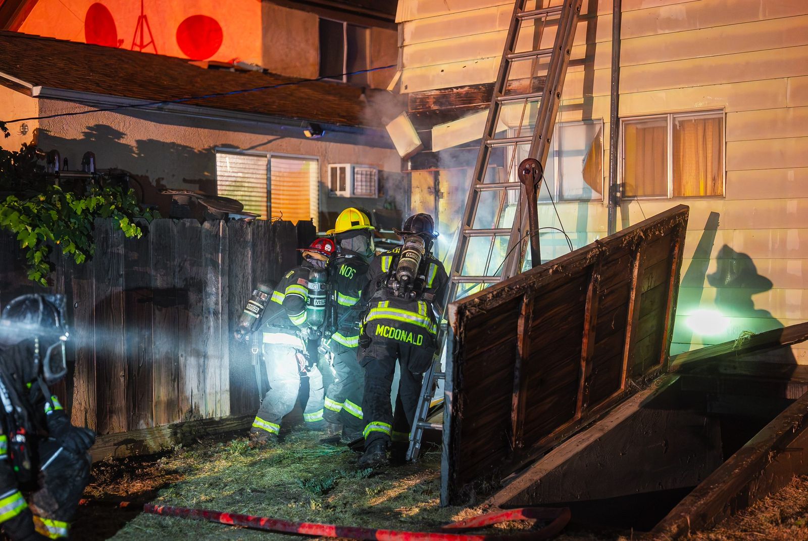Crew in smoke at night — Los Banos Fire Department