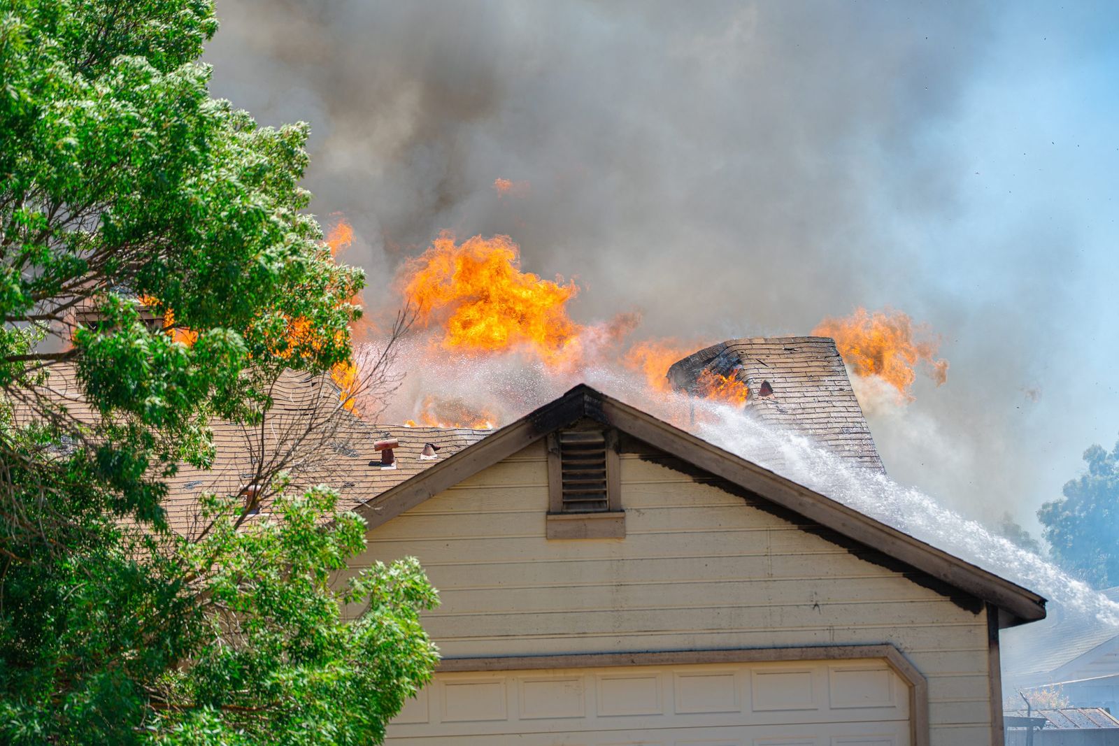 Hose stream on a roof fire — Los Banos Fire Department