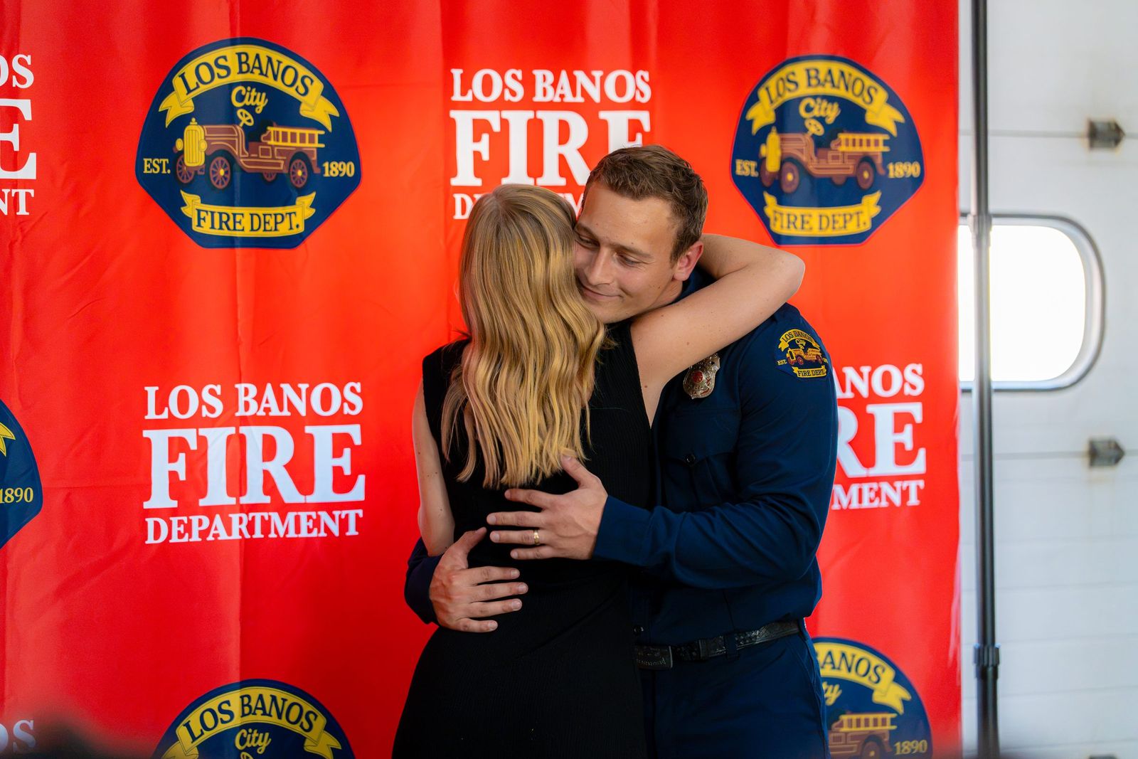 Hug after the pinning — Los Banos Fire Department