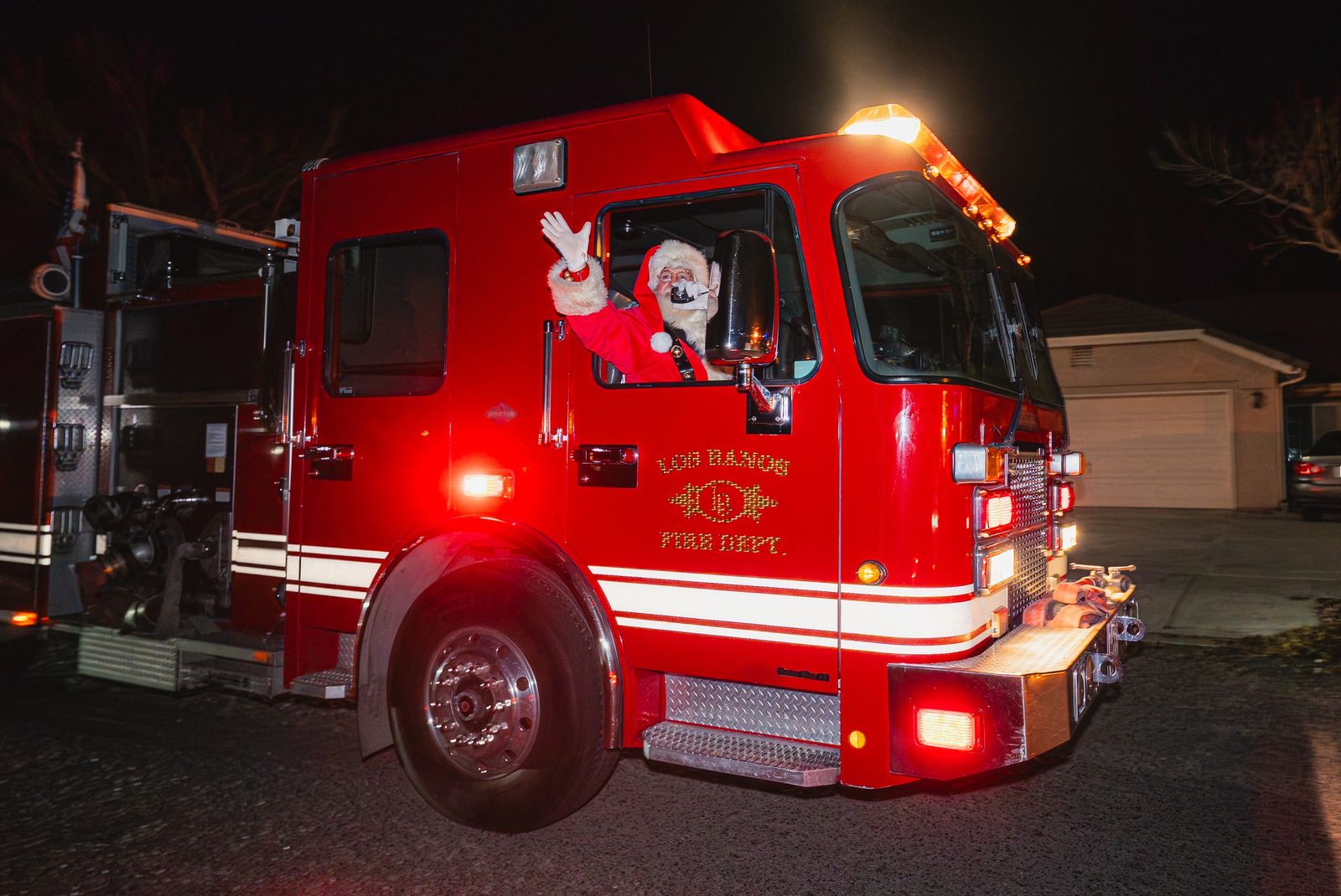 Santa waves from the engine — Los Banos Fire Department