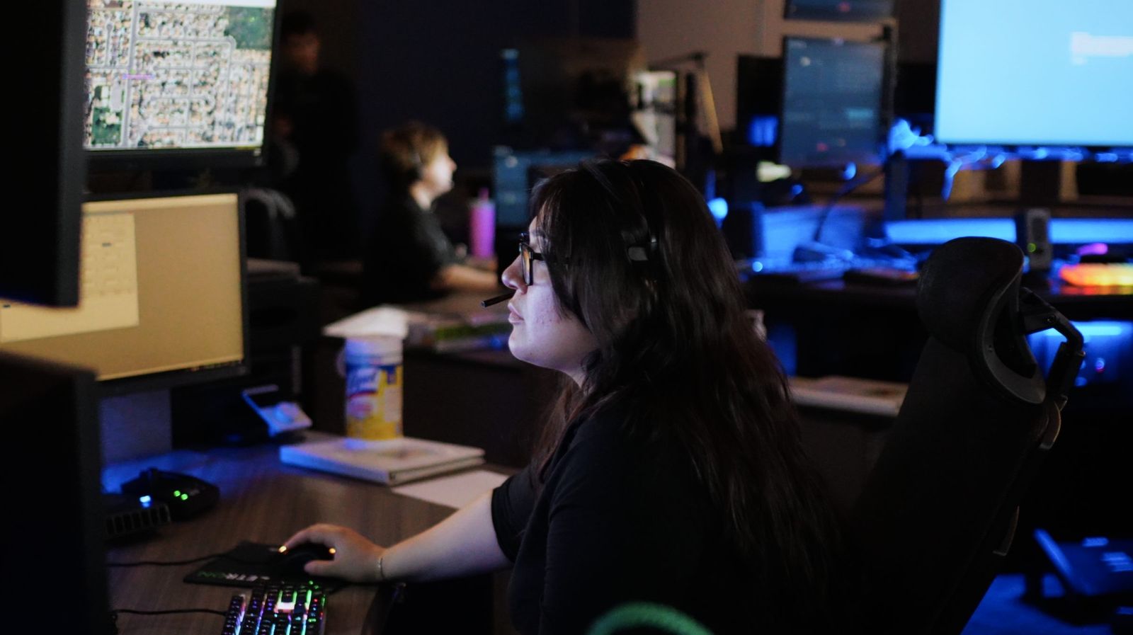 Dispatcher in the blue glow — Los Banos Police Department