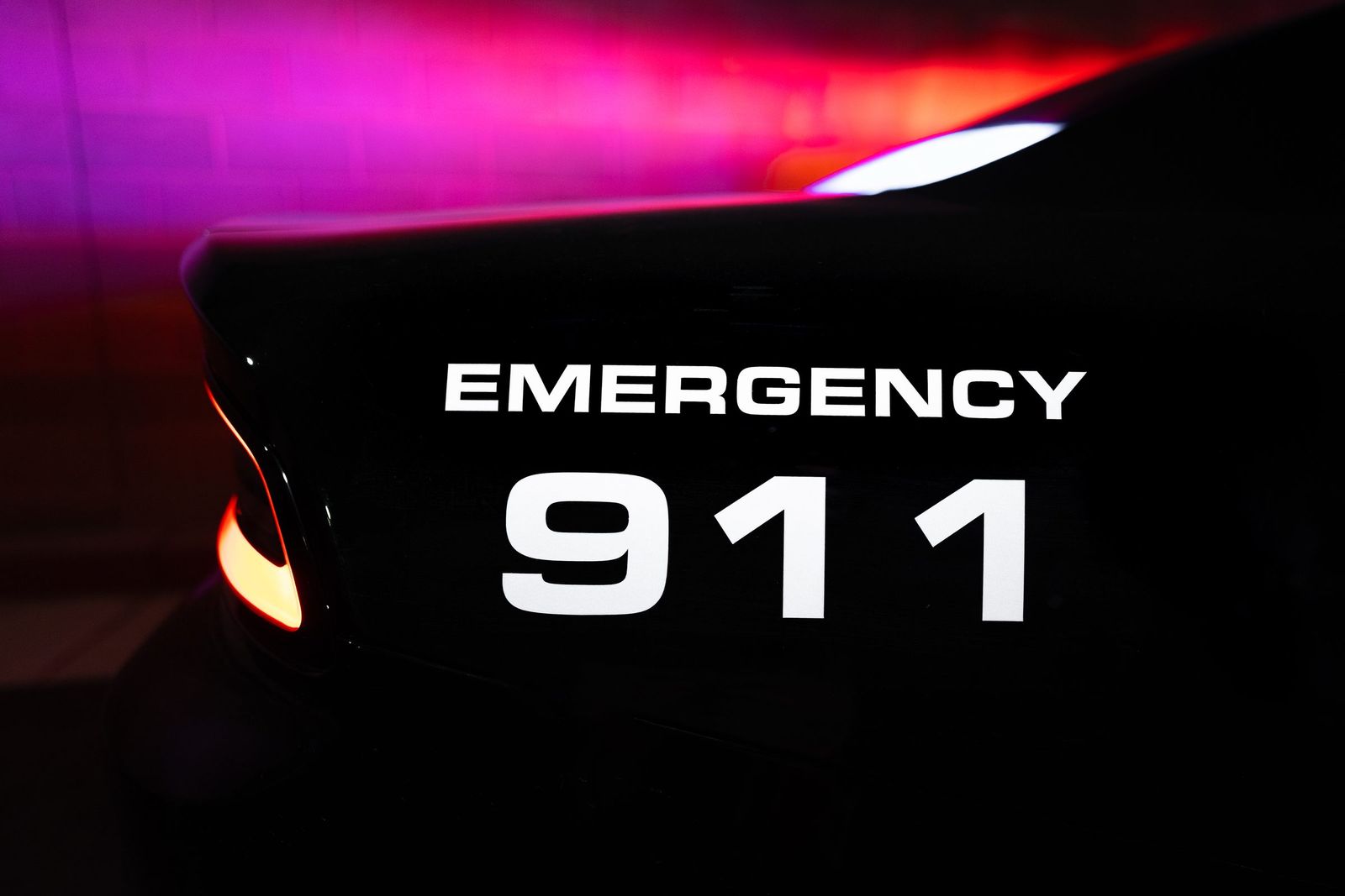 Emergency 911 in magenta light — Los Banos Police Department