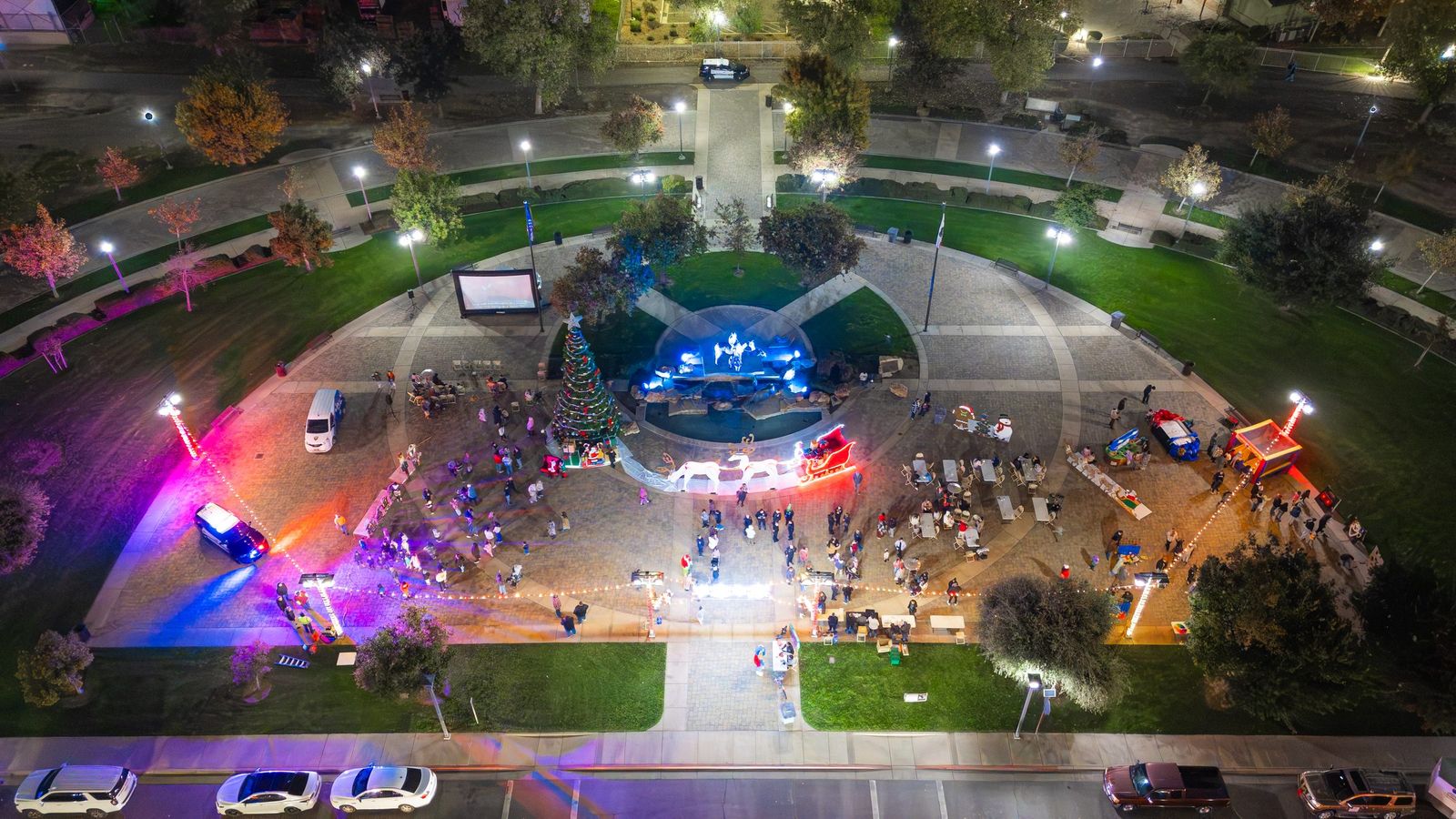 Holiday plaza at night from above — Los Banos Police Department