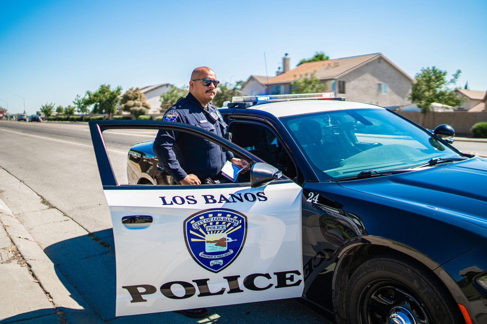 At the patrol car door — Los Banos Police Department