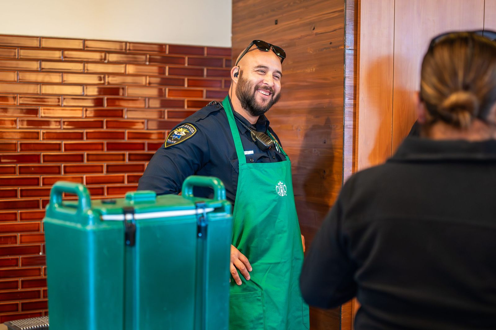 Officer in a barista apron — Los Banos Police Department
