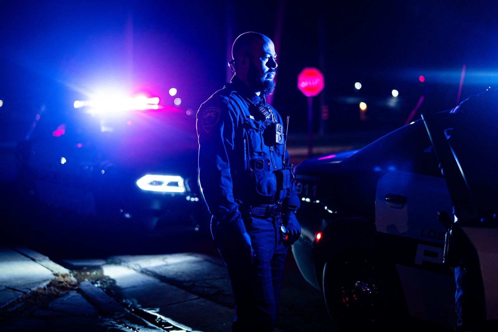 Officer under patrol lights — Los Banos Police Department