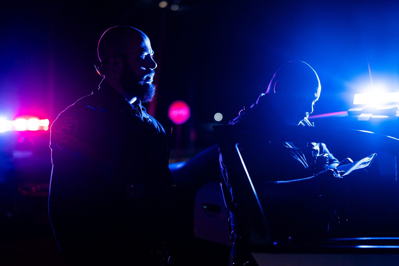Officers under blue lights — Los Banos Police Department