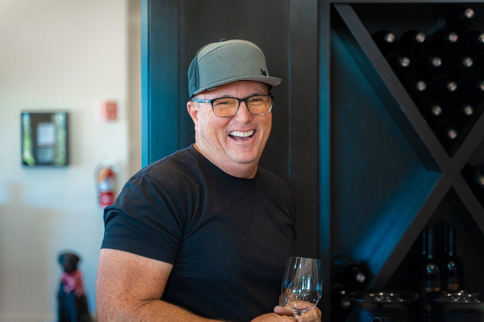 Laughing guest with a wine glass — Verde Vineyards