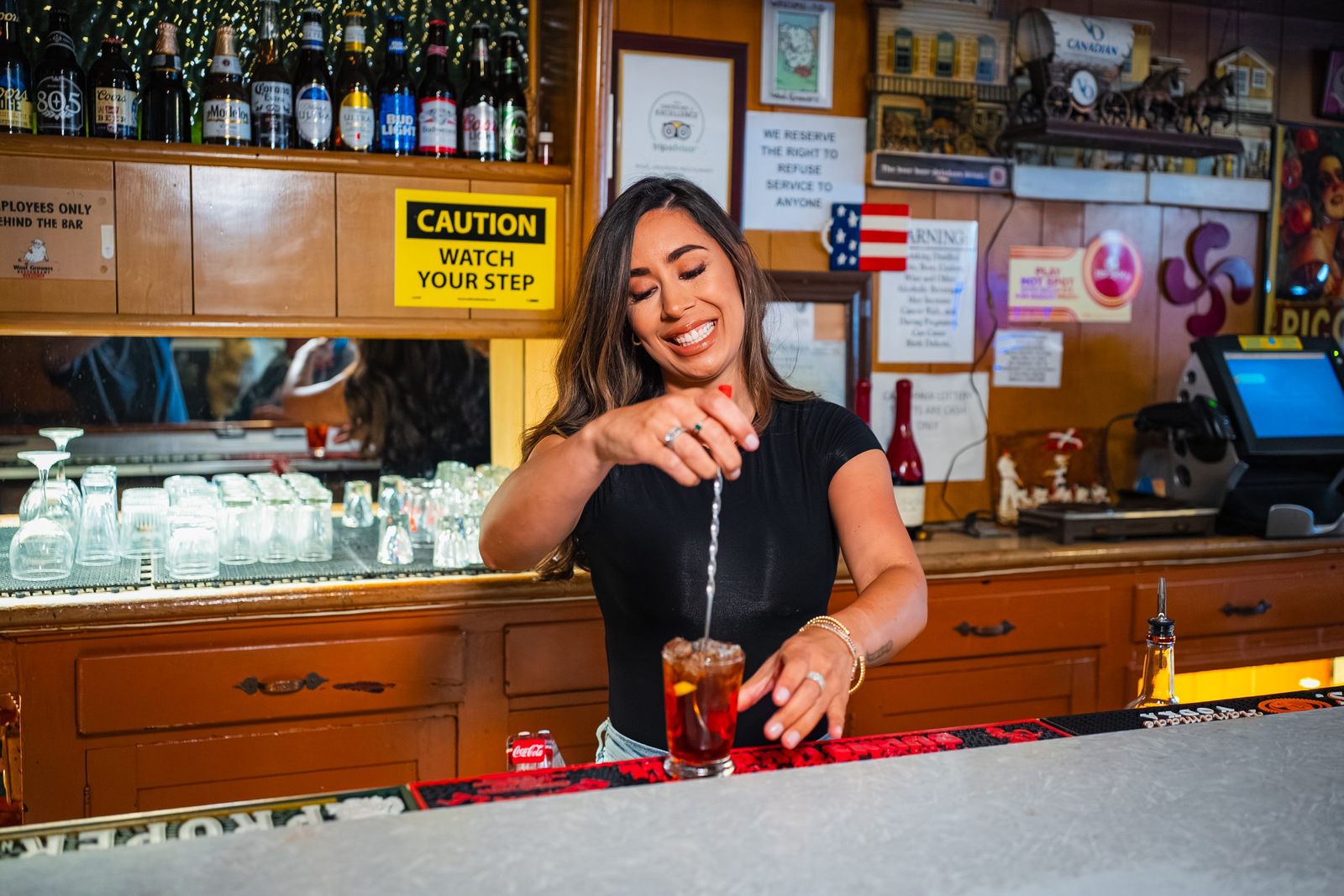 Bartender stirring a cocktail — Wool Growers Restaurant