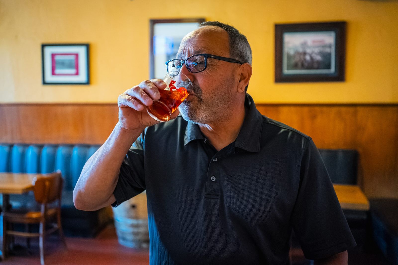 Patron sipping a beer — Wool Growers Restaurant